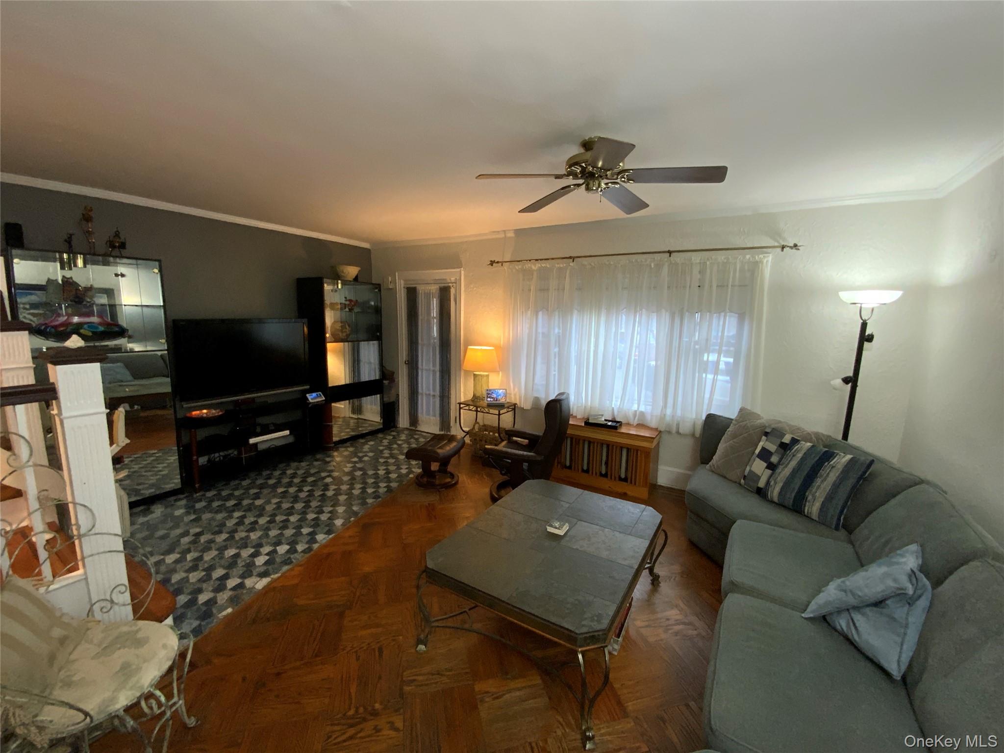 47-05 189th Street Queens, NY 11358 - Photo 3 of 41 a living room with furniture and a flat screen tv