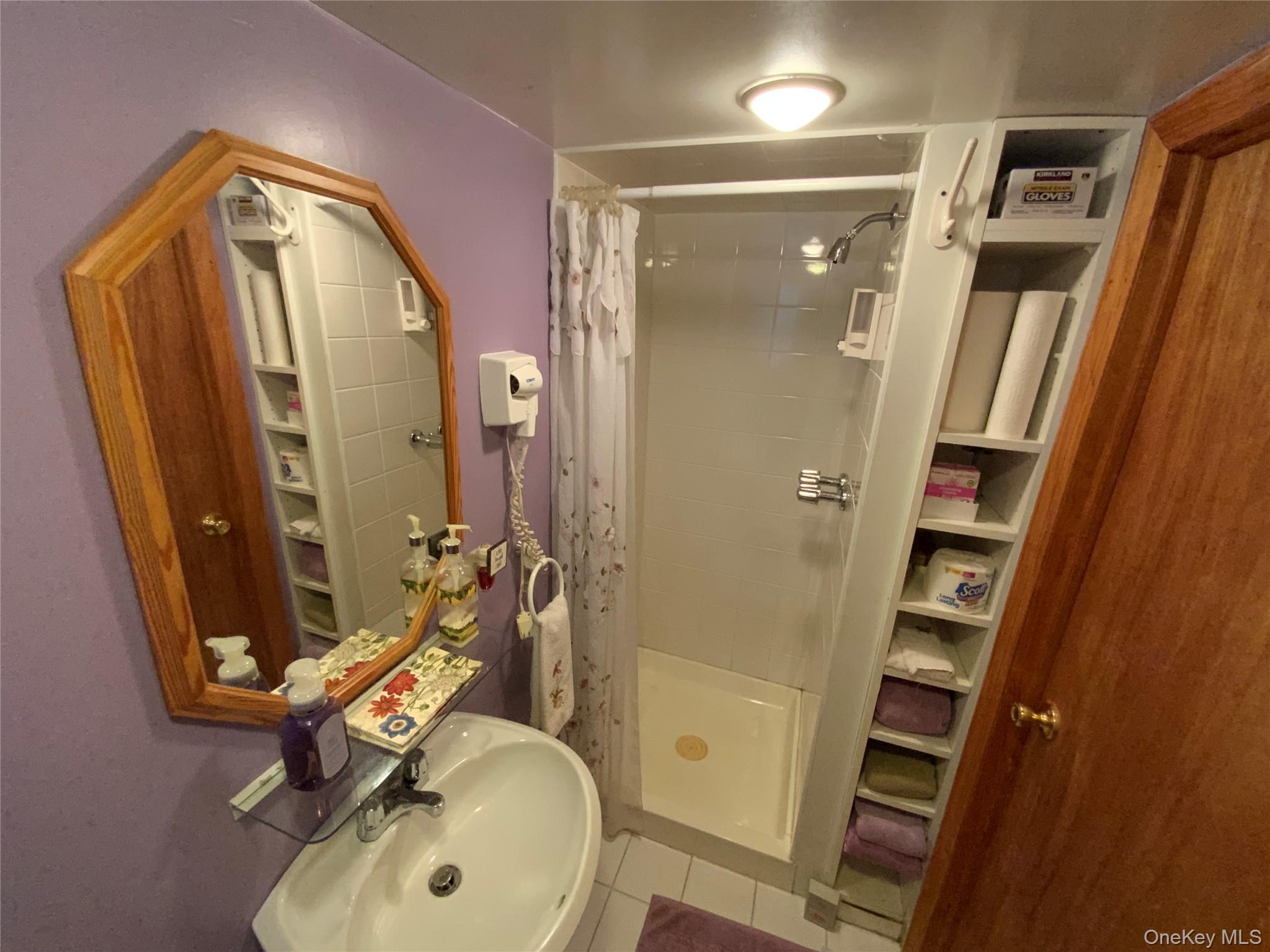 47-05 189th Street Queens, NY 11358 - Photo 36 of 41 a bathroom with a sink a toilet and shower