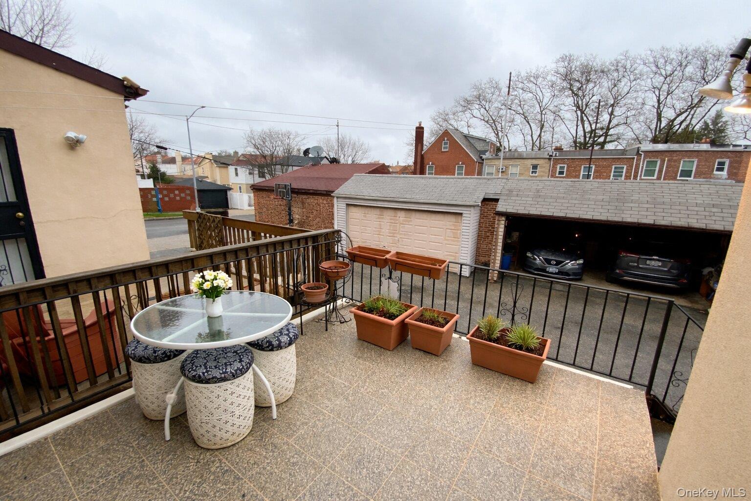 47-05 189th Street Queens, NY 11358 - Photo 39 of 41 a view of a patio with a table and chairs