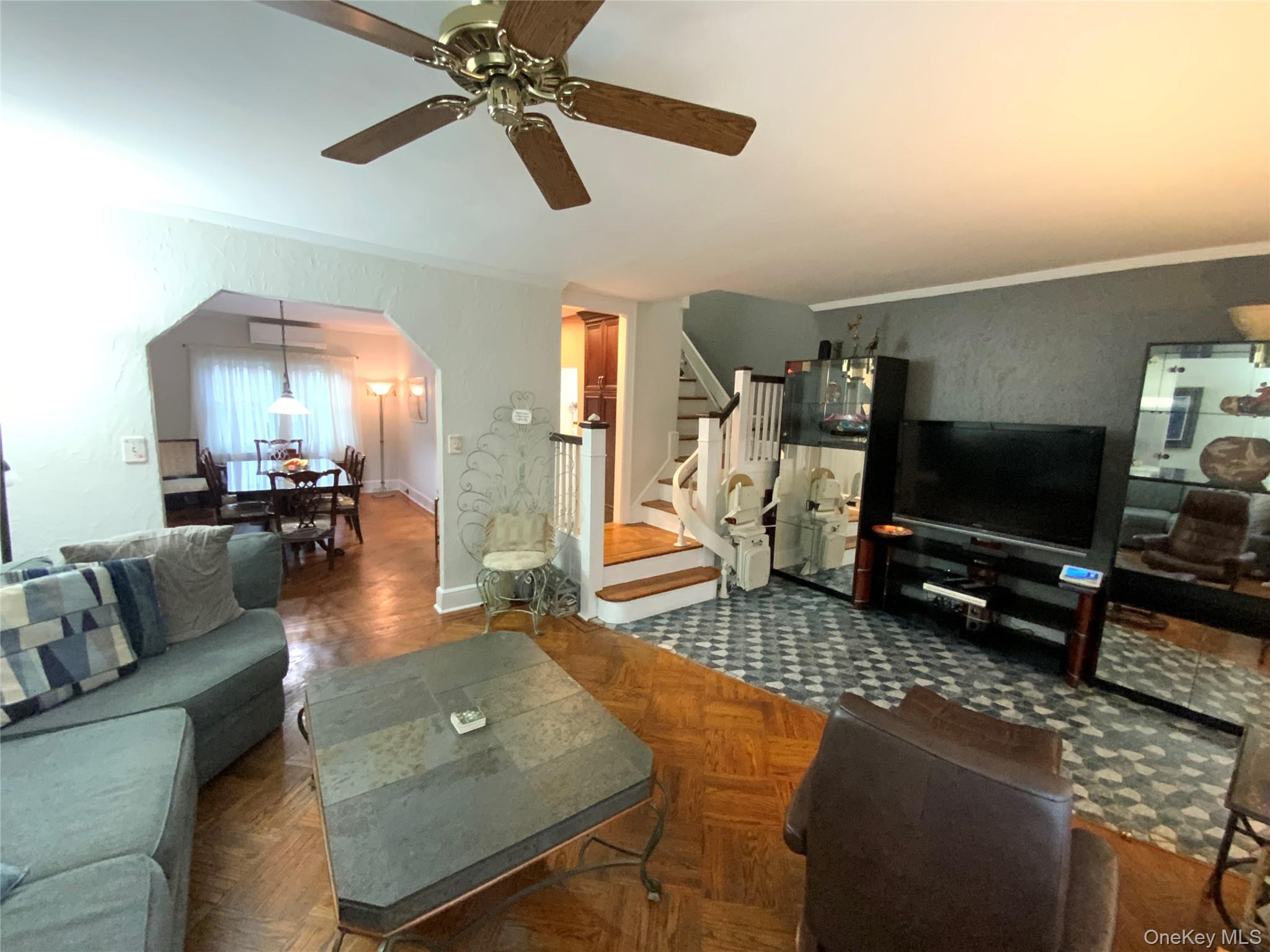 47-05 189th Street Queens, NY 11358 - Photo 4 of 41 a living room with furniture and a flat screen tv