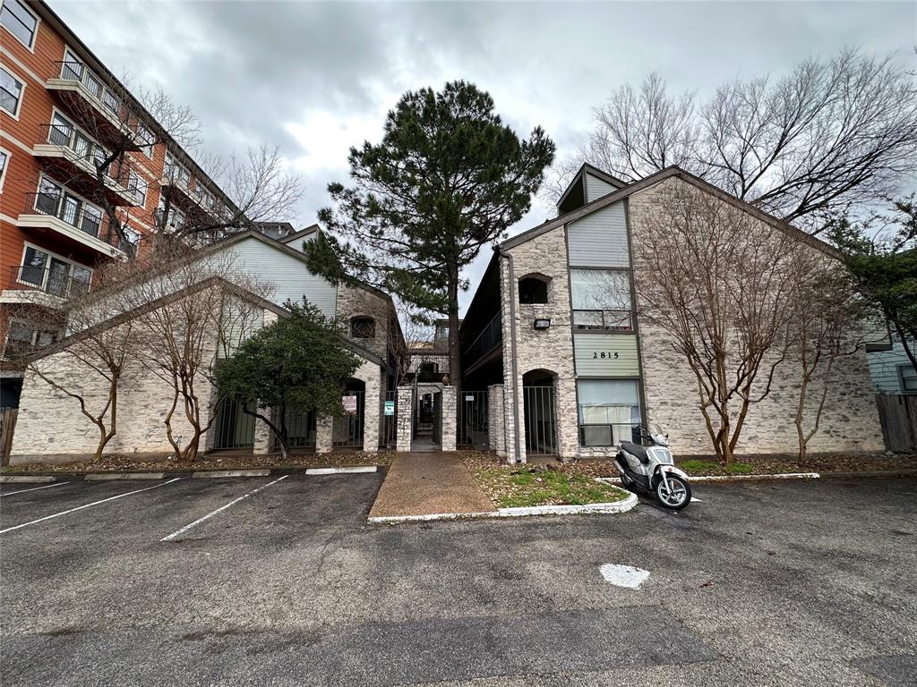 2815 Rio Grande Street, Unit 205 Austin, TX 78705 - Photo 13 of 20 a view of a house with a snow in the yard