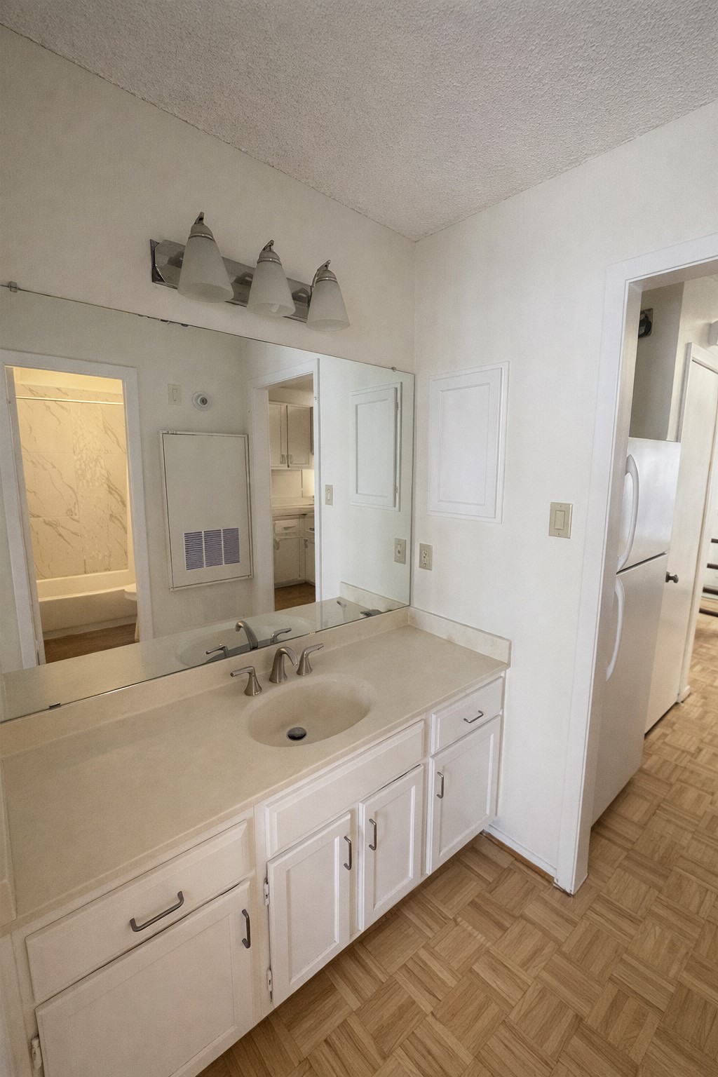2815 Rio Grande Street, Unit 205 Austin, TX 78705 - Photo 5 of 20 a bathroom with a double vanity sink and mirror