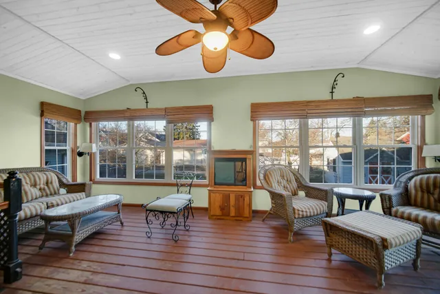 a view of a house with a yard and sitting area