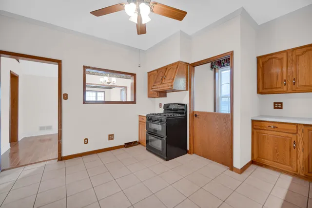 a kitchen with stainless steel appliances granite countertop a refrigerator a stove top oven a sink and dishwasher