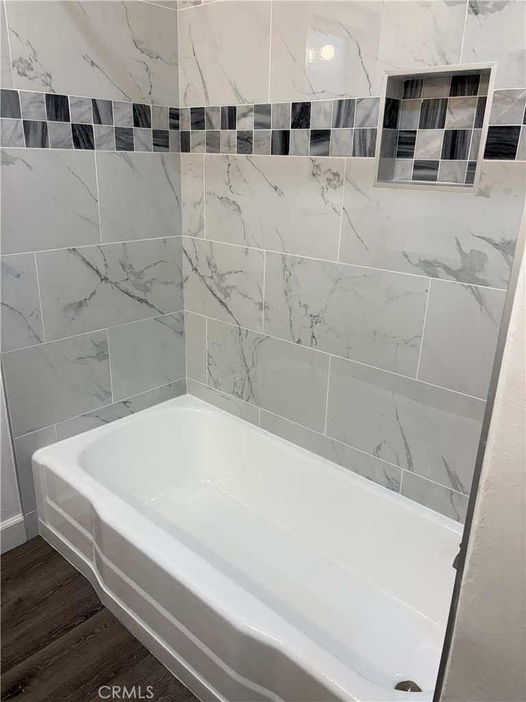 3706 Redondo Beach Boulevard, Unit B Torrance, CA 90504 - Photo 11 of 18 a bathroom with a bathtub and shower