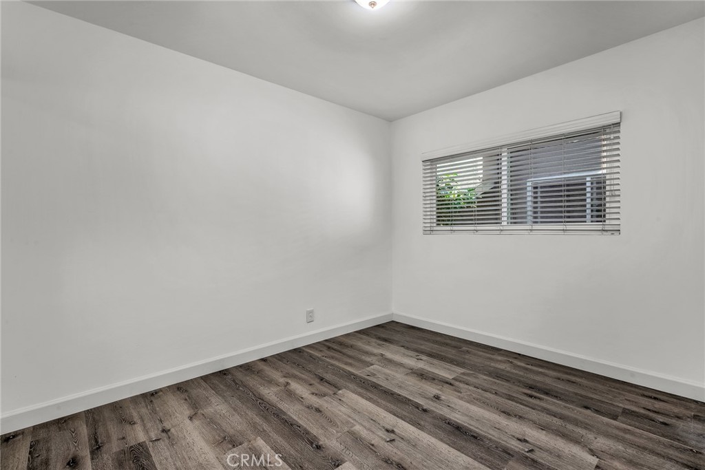 3706 Redondo Beach Boulevard, Unit B Torrance, CA 90504 - Photo 13 of 18 a view of empty room with wooden floor and fan