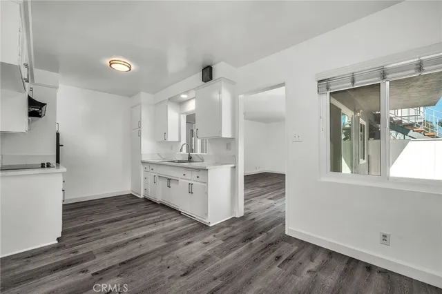 a kitchen with a sink and cabinets