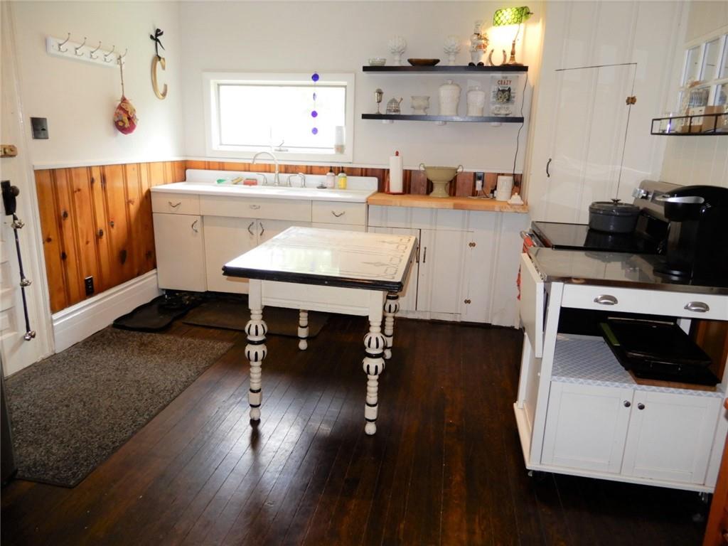 590 Imel Road Normalville, PA 15469 - Photo 11 of 30 a kitchen with stainless steel appliances wooden floor and a view of living room