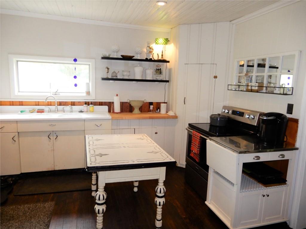 590 Imel Road Normalville, PA 15469 - Photo 12 of 30 a kitchen with stainless steel appliances a stove a sink and a refrigerator