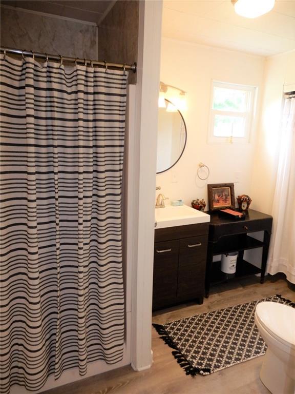 590 Imel Road Normalville, PA 15469 - Photo 18 of 30 a bathroom with a sink a mirror and a shower