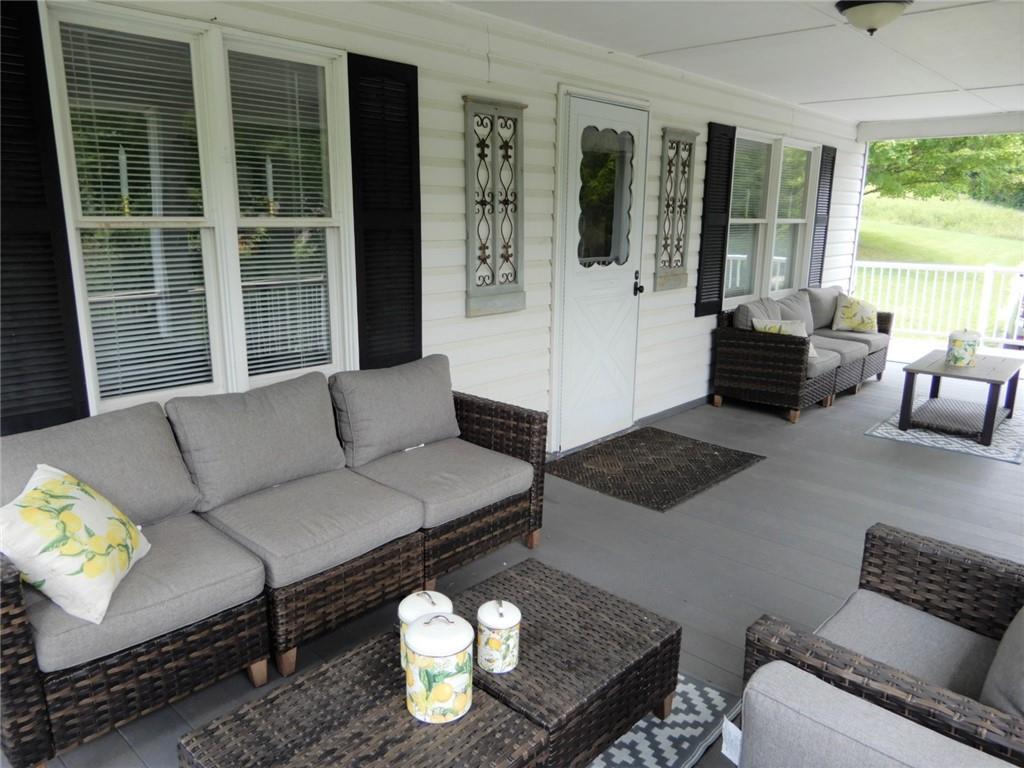590 Imel Road Normalville, PA 15469 - Photo 2 of 30 a living room with furniture and floor to ceiling windows