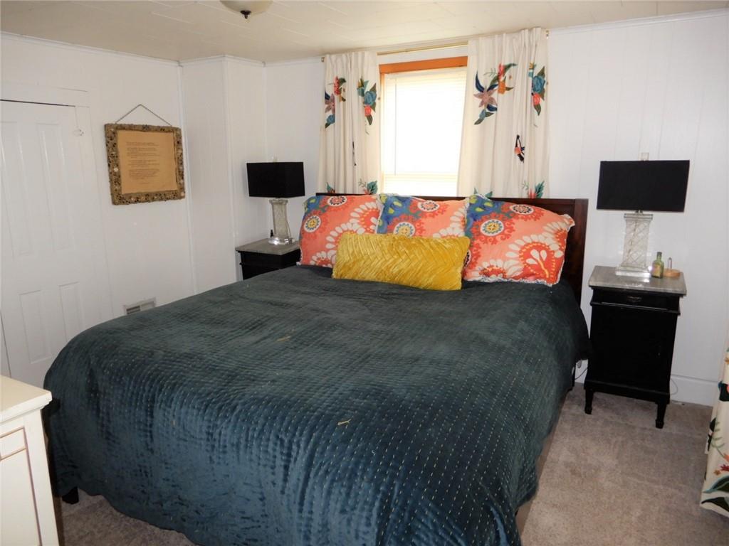 590 Imel Road Normalville, PA 15469 - Photo 23 of 30 a bedroom with a bed tv and a window