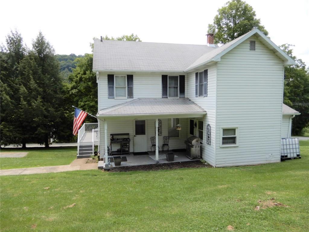 590 Imel Road Normalville, PA 15469 - Photo 24 of 30 a view of a house with a yard patio and slide