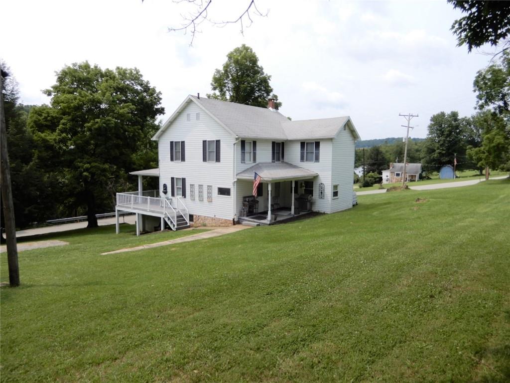 590 Imel Road Normalville, PA 15469 - Photo 25 of 30 a view of a house with a yard and sitting area