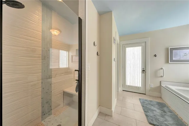 a room with lots of windows and furniture