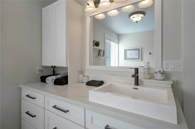 a spacious bathroom with a bathtub and window