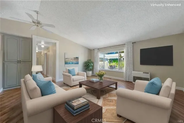 a bedroom with a bed chandelier and a window