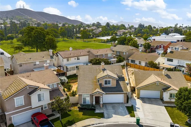 a view of multiple houses with a city view