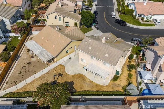 an aerial view of residential houses with outdoor space