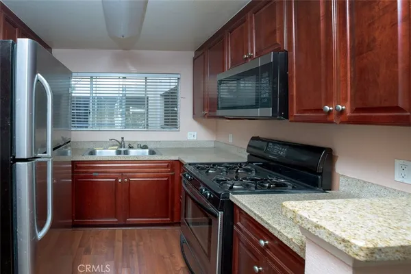 a kitchen with sink cabinets and window