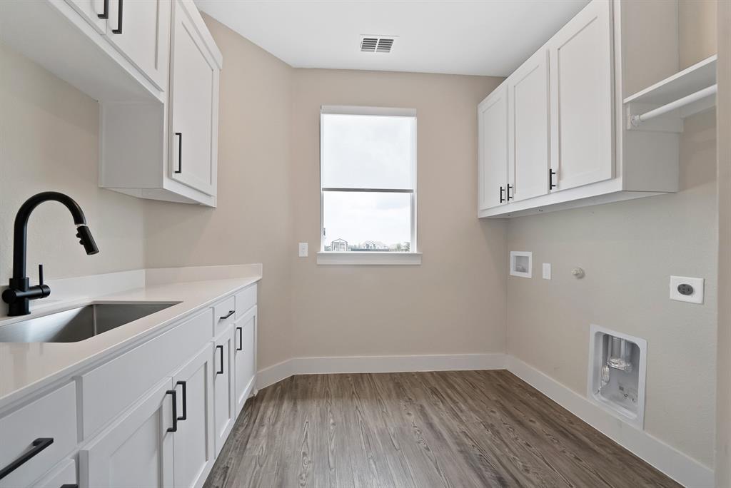 2223 Providence Way Nevada, TX 75173 - Photo 28 of 40 a kitchen with sink and cabinets