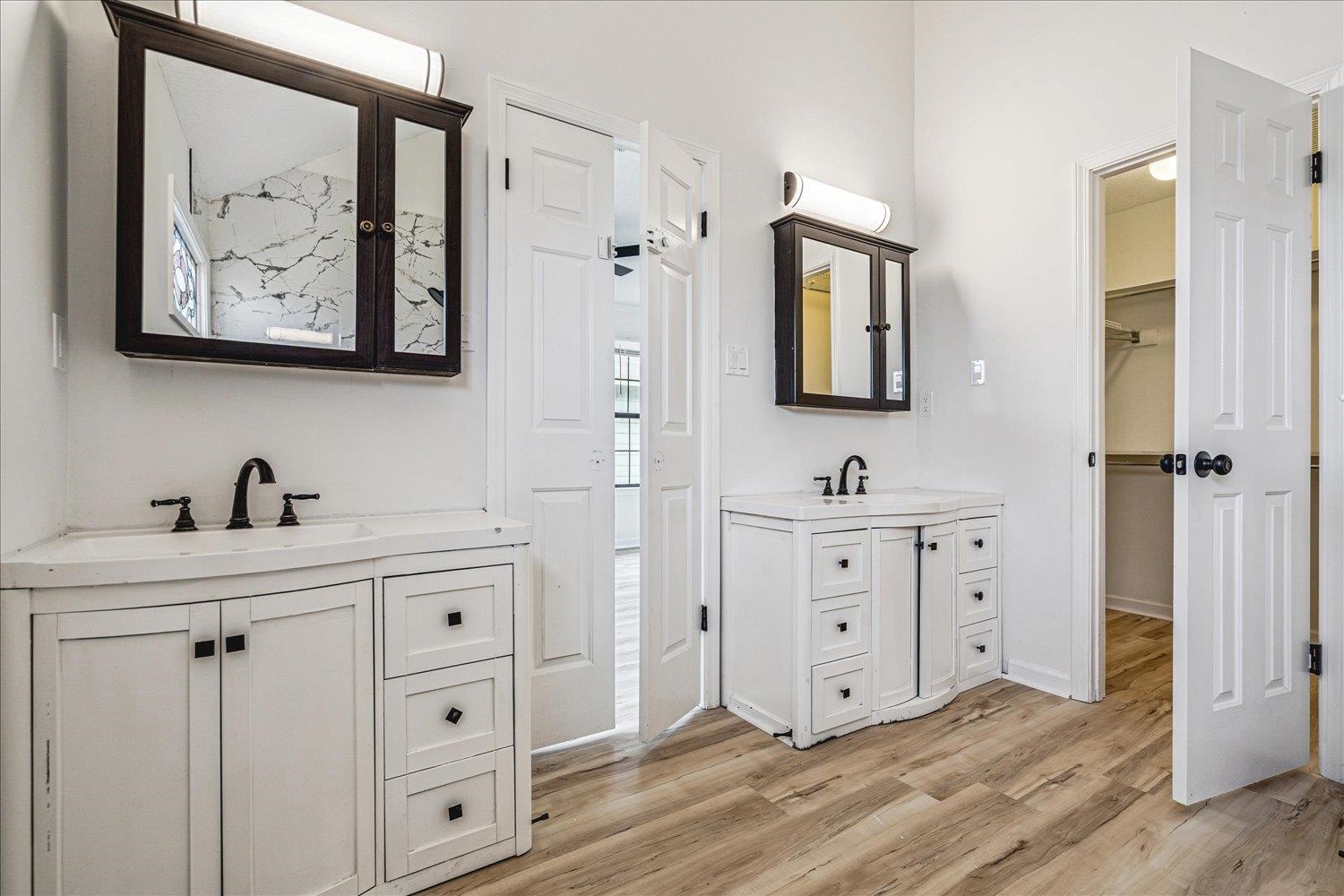 5287 Shady Ridge Drive Memphis, TN 38141 - Photo 13 of 13 Full bath featuring two vanities, light wood-style floors, and a walk in closet