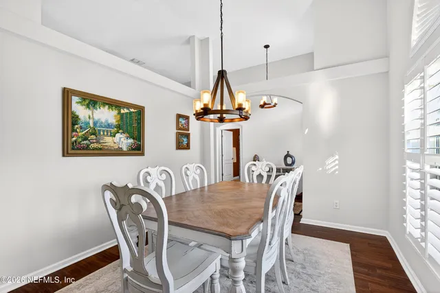 a bedroom with a bed and ceiling fan
