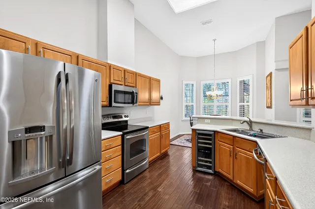 a spacious bathroom with a tub sink shower and mirror