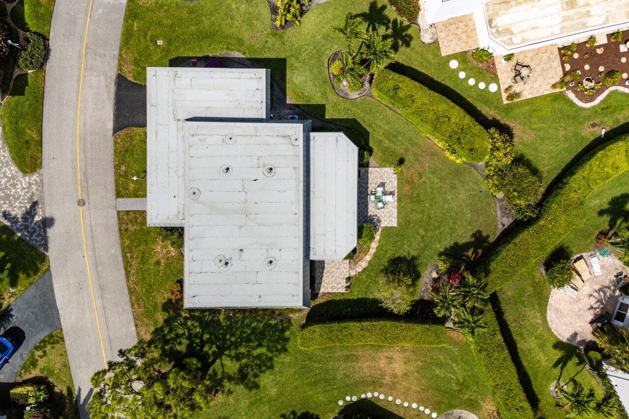401 French Royale Circle Atlantis, FL 33462 - Photo 42 of 47 an aerial view of a house with a yard