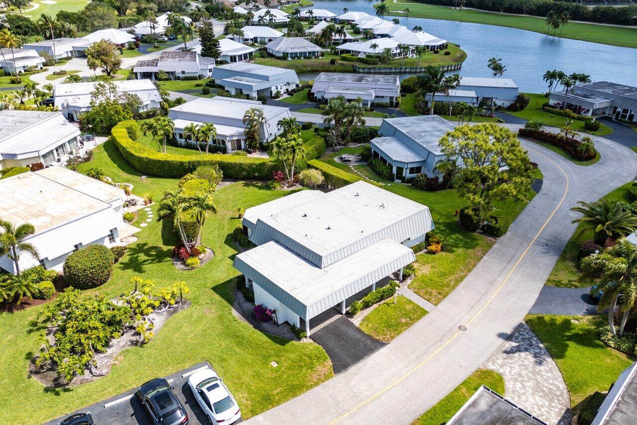 401 French Royale Circle Atlantis, FL 33462 - Photo 44 of 47 an aerial view of a house with swimming pool and outdoor seating