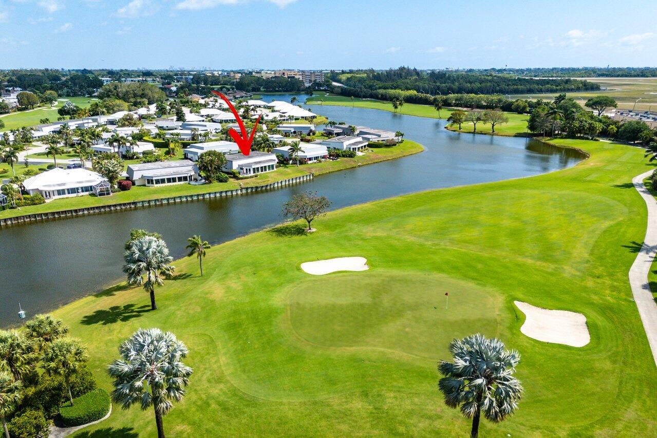 401 French Royale Circle Atlantis, FL 33462 - Photo 47 of 47 a view of a lake with a city