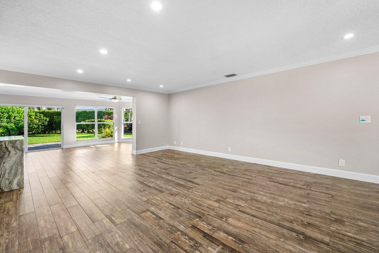 401 French Royale Circle Atlantis, FL 33462 - Photo 9 of 47 a view of room with wooden floor and window