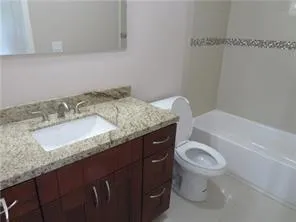 a bathroom with a toilet and a window