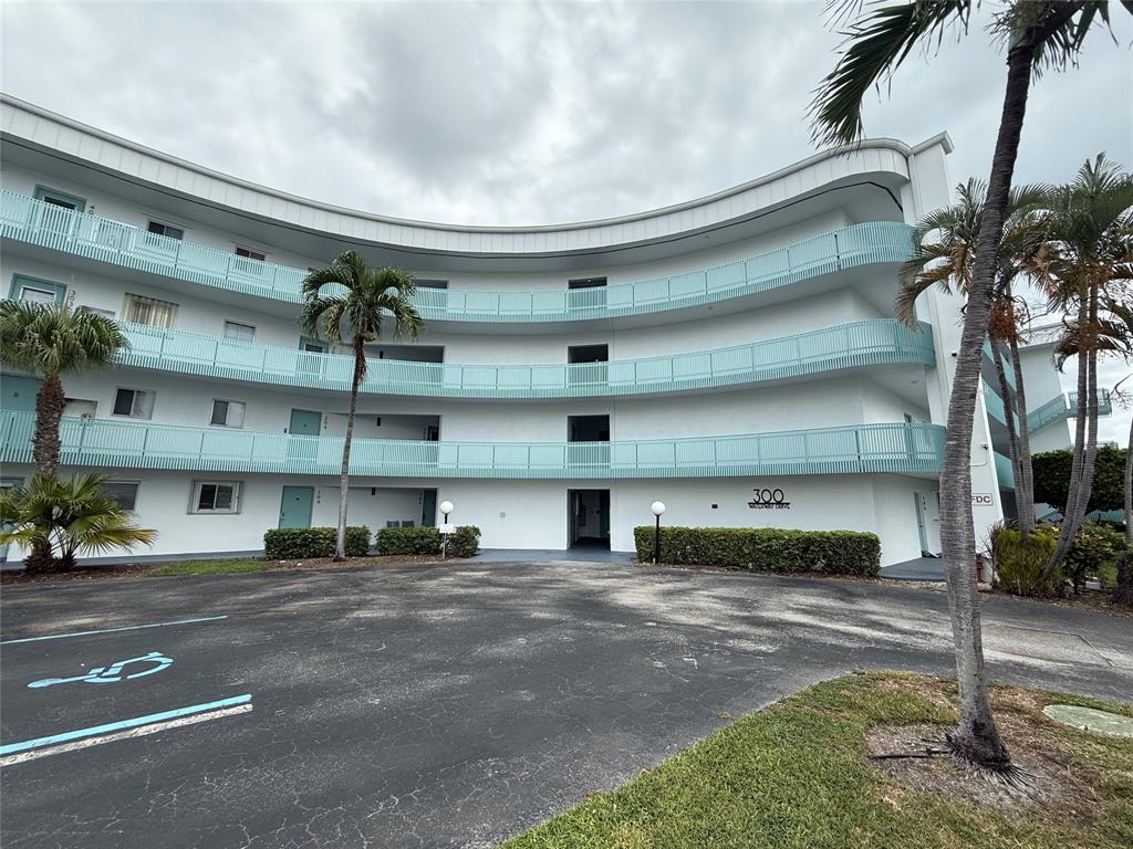 a view of a street that has a street sign on the side of the road