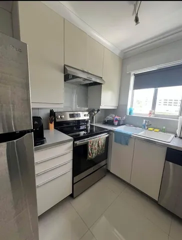 a kitchen with a stove and a sink