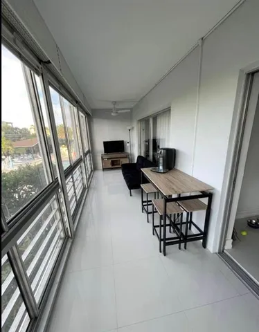 a view of a chairs and table in a balcony