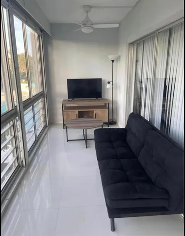 a living room with furniture and a flat screen tv