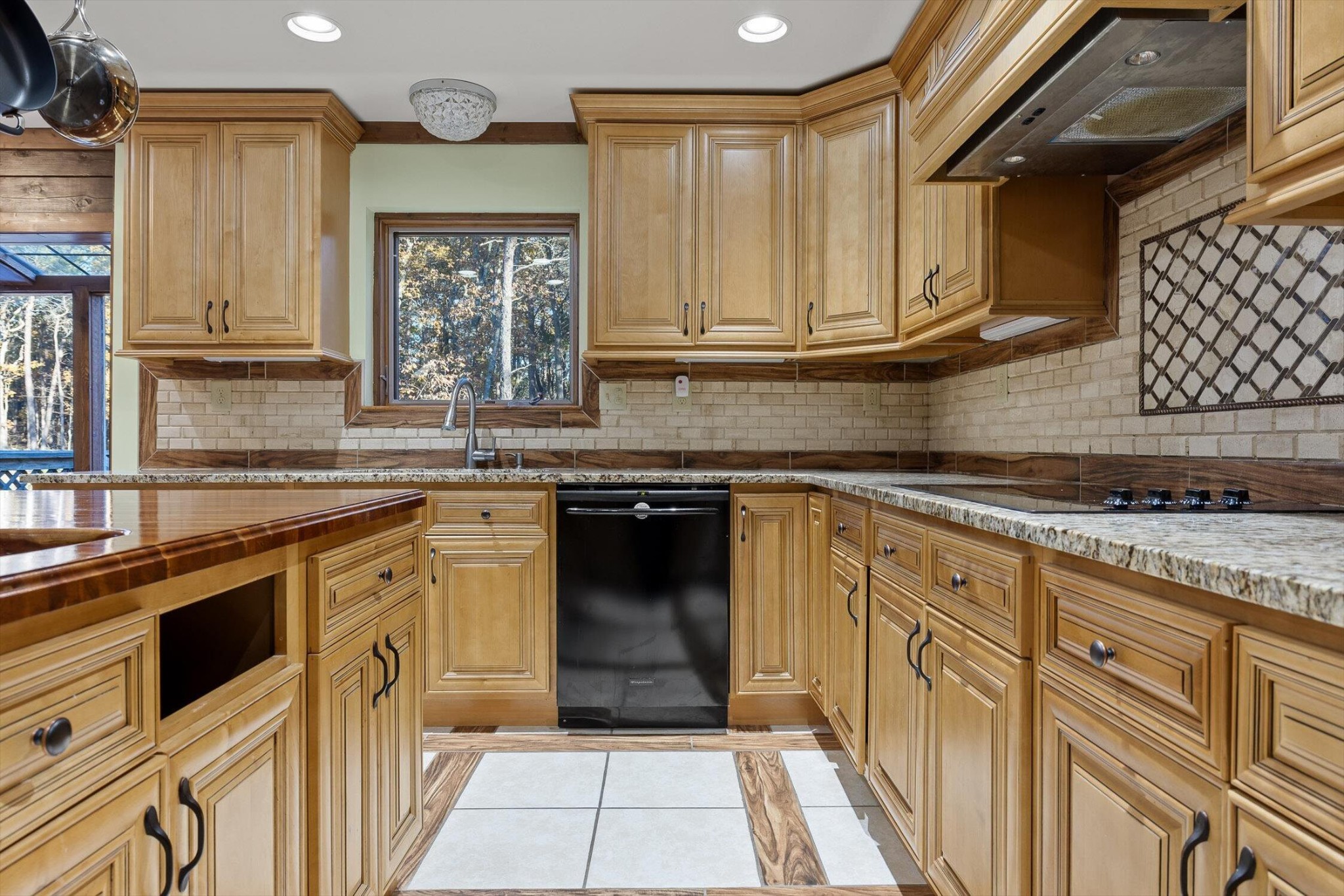 504 Wolf Run Rising Fawn, GA 30738 - Photo 33 of 100 a kitchen with stainless steel appliances granite countertop a stove a sink and a microwave