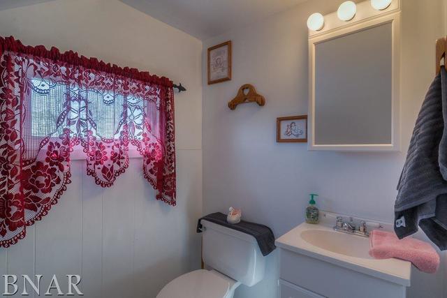 15276 Cedar Road Le Roy, IL 61752 - Photo 14 of 30 a bathroom with a sink mirror and toilet