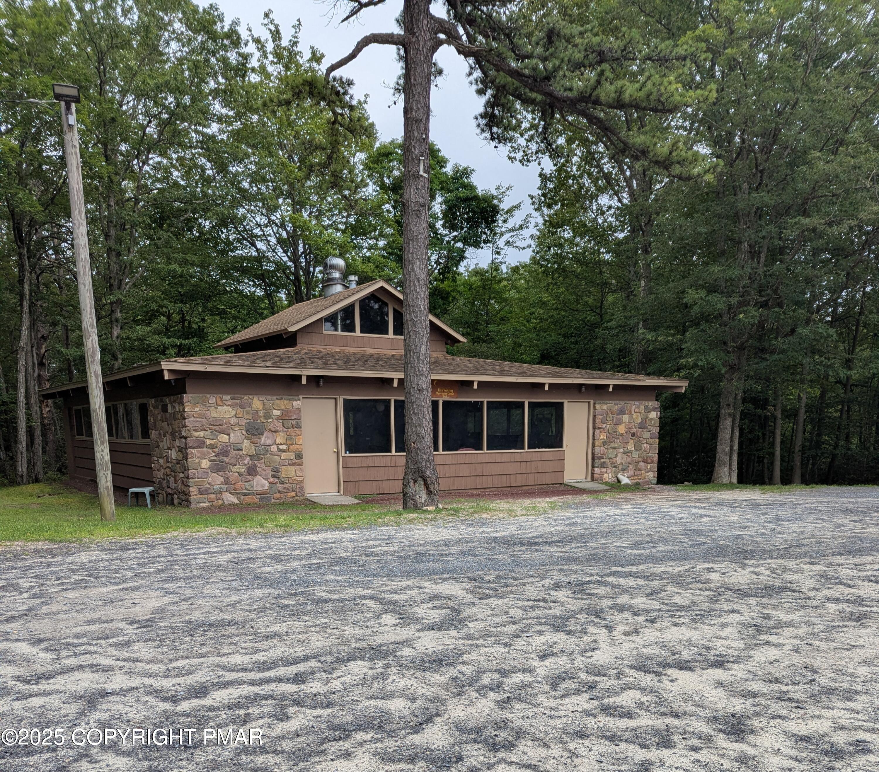 17 Birch Lane Scotrun, PA 18355 - Photo 11 of 13 a front view of a house with a yard and garage