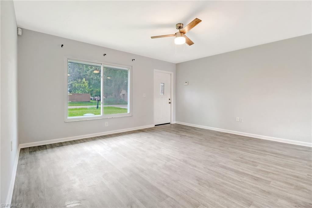 19161 Acorn Road Fort Myers, FL 33967 - Photo 4 of 23 wooden floor in an empty room with a window