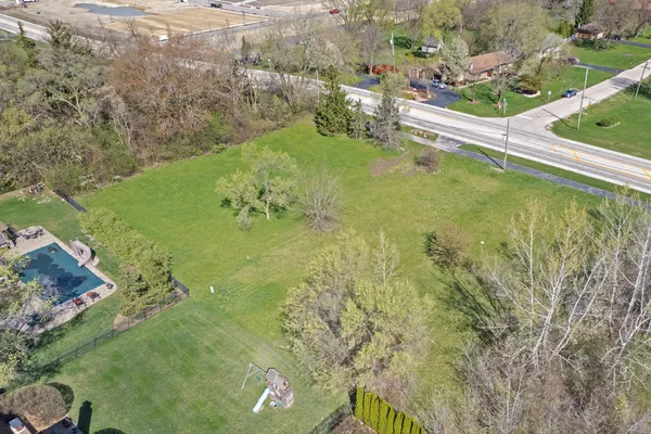 a view of field with trees in the background