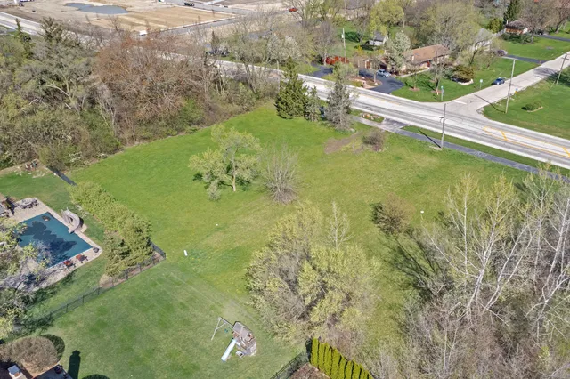 a view of field with trees in the background