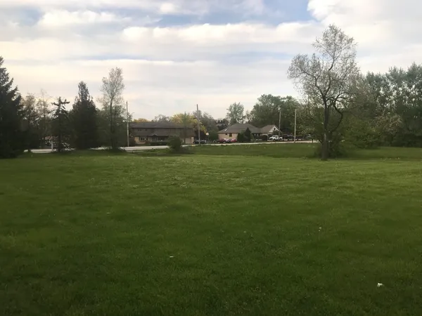 a view of a garden with a building