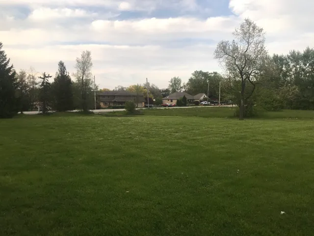a view of a garden with a building