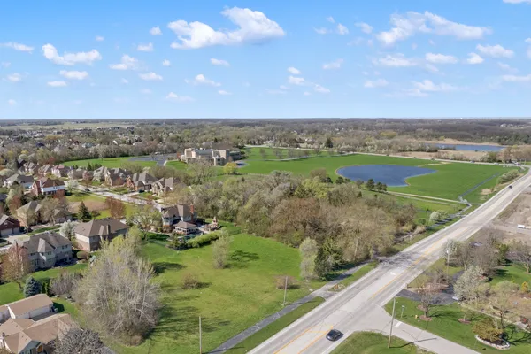 a view of a lake with a yard