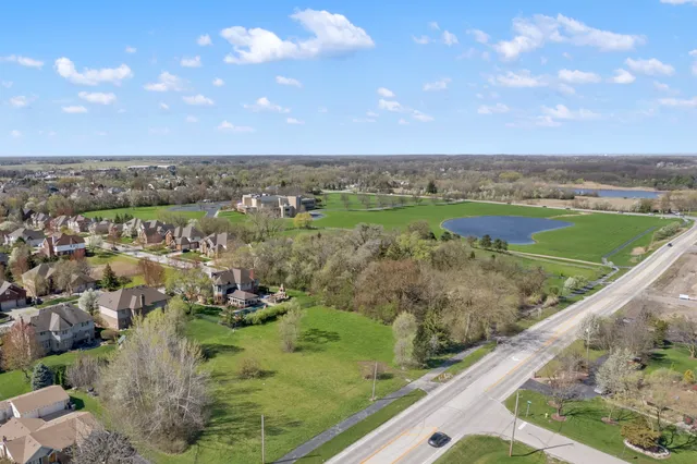 a view of a lake with a yard
