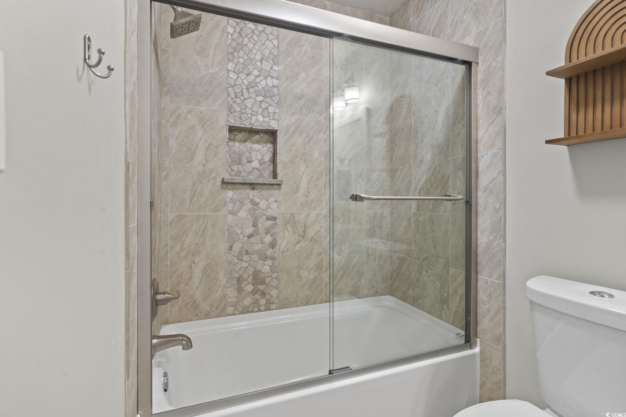 220 Rice Mill Drive Myrtle Beach, SC 29588 - Photo 21 of 31 Full bath with bath / shower combo with glass door and toilet