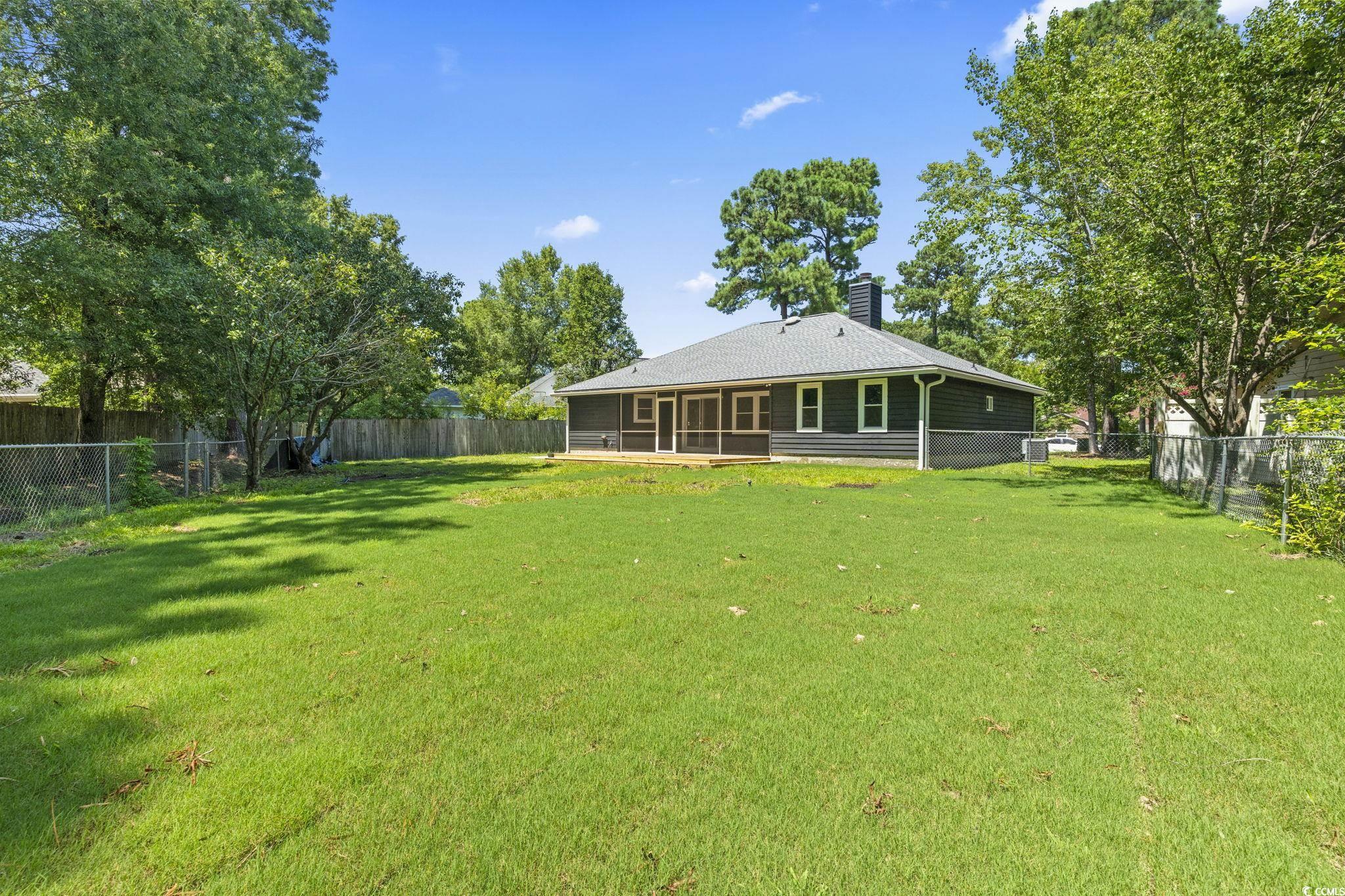 220 Rice Mill Drive Myrtle Beach, SC 29588 - Photo 25 of 31 Fenced backyard featuring a sunroom