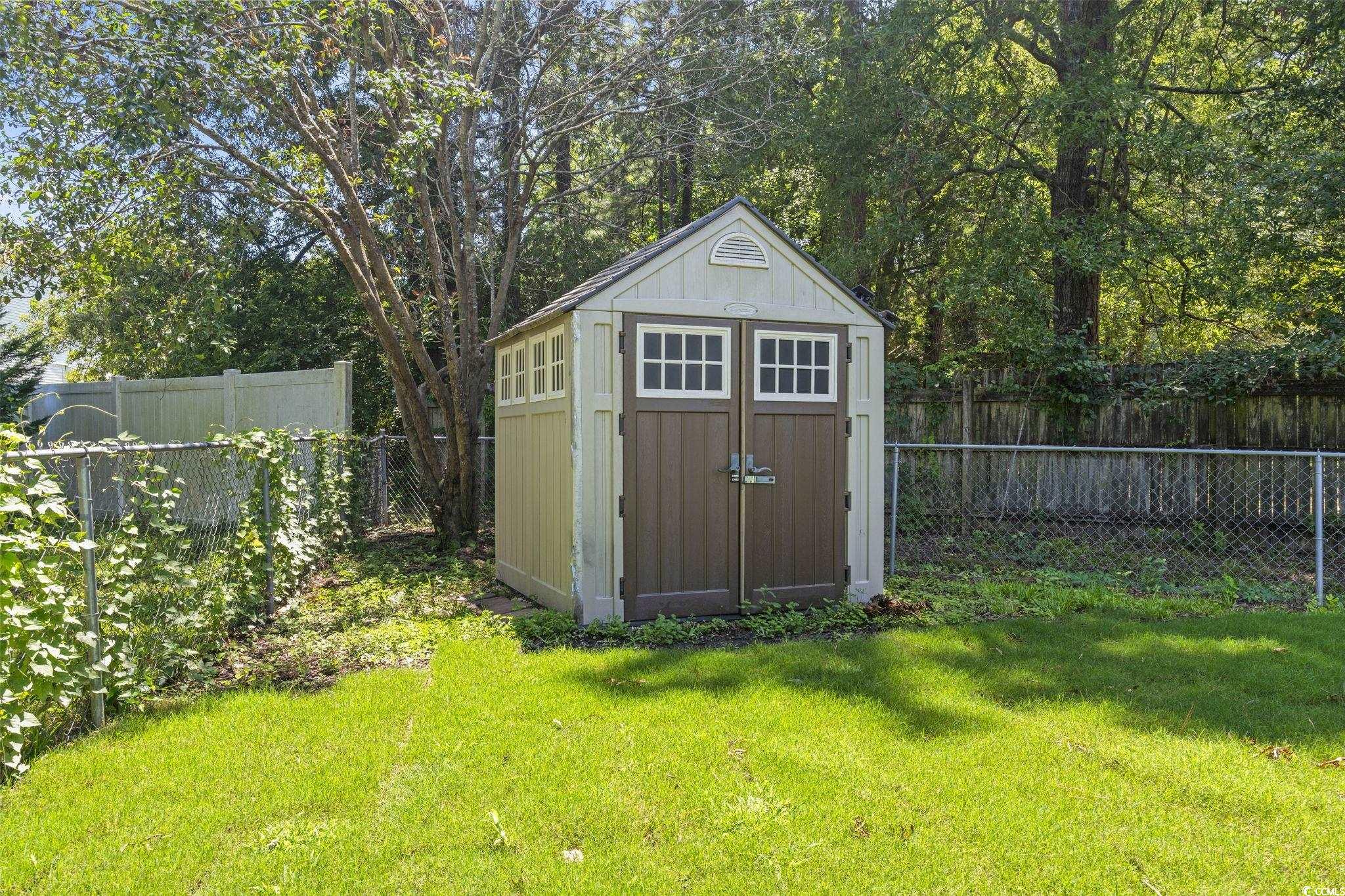 220 Rice Mill Drive Myrtle Beach, SC 29588 - Photo 27 of 31 View of shed featuring a fenced backyard